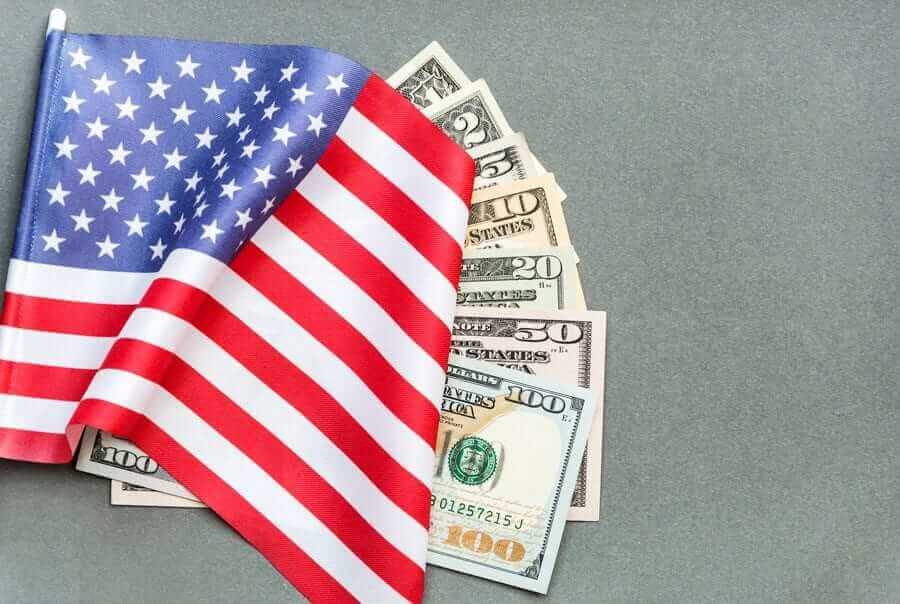 American Flag on top of American dollar bills