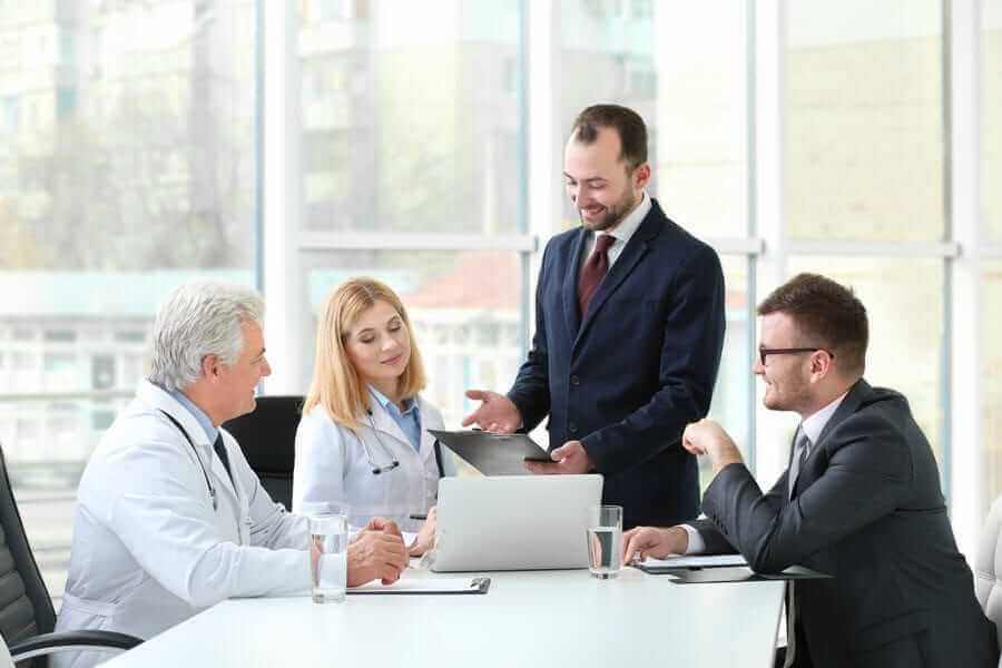 Doctors and Business People discussing in a board room