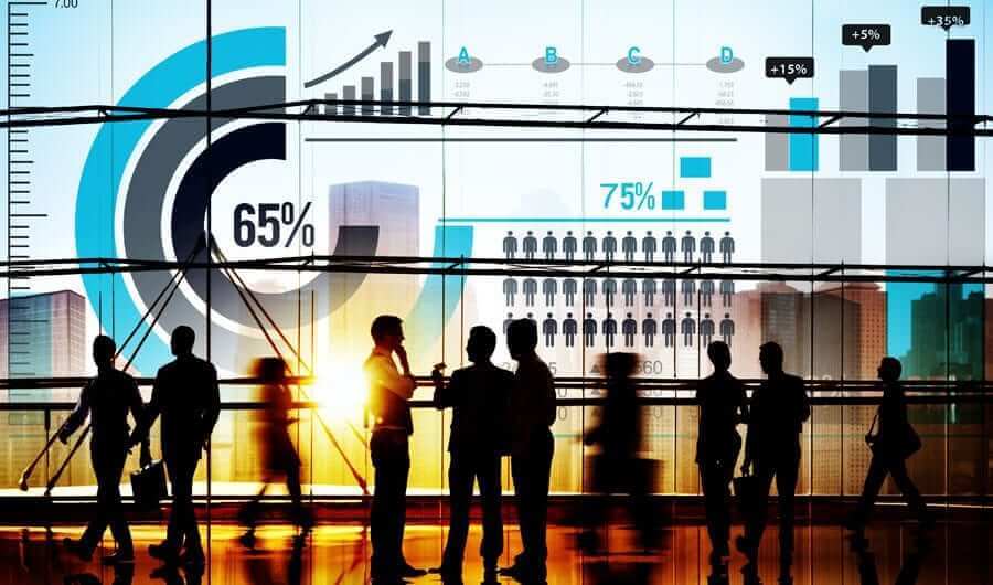 Silhouette of multiple business people in office with data graphics around image
