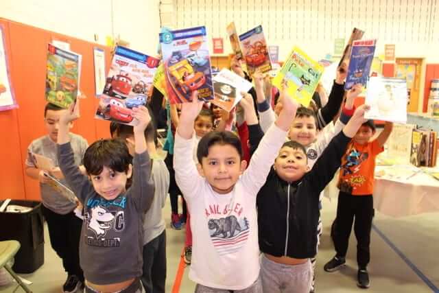 Book Fairies Children Holding up Books from Book Fair