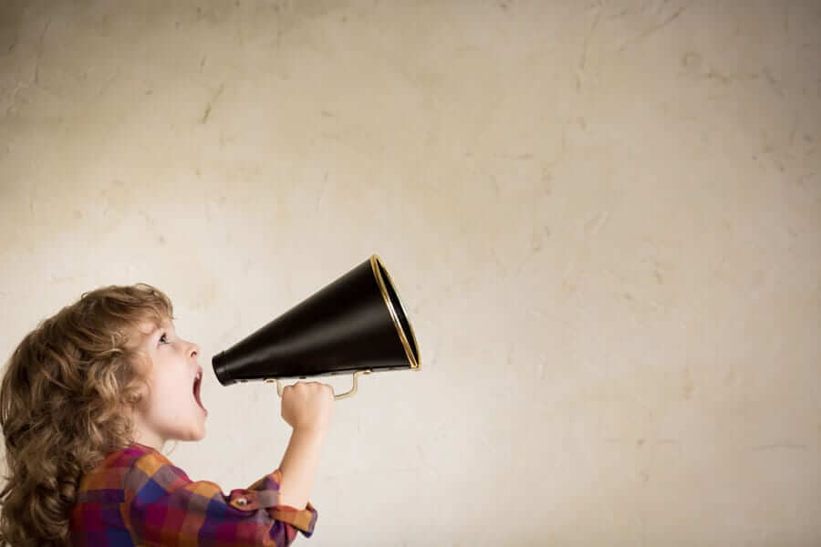 child speaking into megaphone